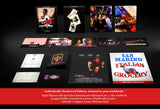 Collection of movie posters and packaging on a dark surface with a red accent.