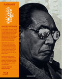 Blu-ray cover of 'The Godfather' with a close-up of a man wearing glasses, featuring an orange sidebar with text.