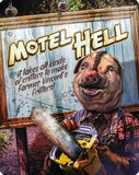Cartoon pig holding a chainsaw with a sign that reads 'Motel Hell' and 'Farmer Vincent's Fritters'.